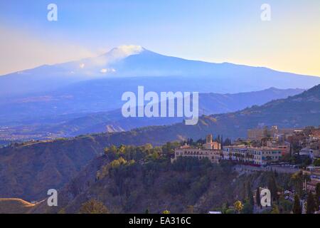 View from Greek Theatre to Taormina with Mount Etna in background, Taormina, Sicily, Italy, Europe Stock Photo