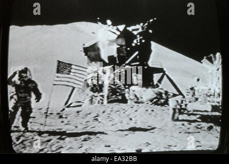 Moon landing lunar module Eagle, US American stars and stripes flag and astronaut 20 July 1969 photographed in actual real time on television TV in LA Los Angeles  California USA  KATHY DEWITT Stock Photo