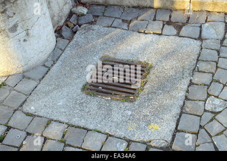 Manhole cover metal in a city street Stock Photo