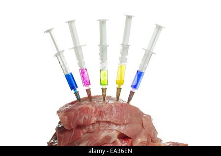Injection into fresh meat on white background Stock Photo
