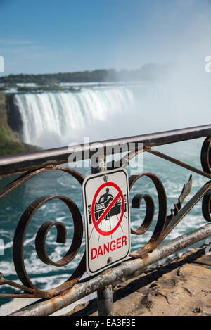A sign warning not to climb railing at Niagara Falls Canada Stock Photo ...