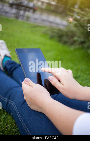 Woman using digital tablet PC Stock Photo