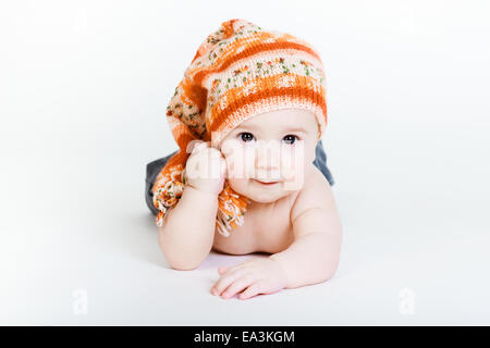 Little baby boy in a knitted hat posing Stock Photo