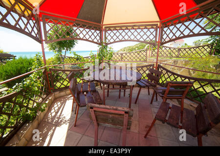 Table and chairs in arbour, Anapa, Krasnodar region, Russia Stock Photo