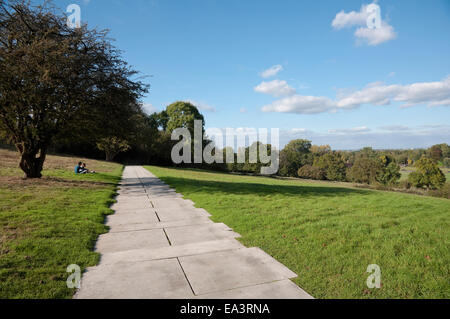 Sunlit terrace walk / path linking John F Kennedy Memorial Stone to the Seats of Contemplation at Runnymede, UK. Stock Photo