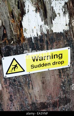 Warning sign for sudden drop Stock Photo