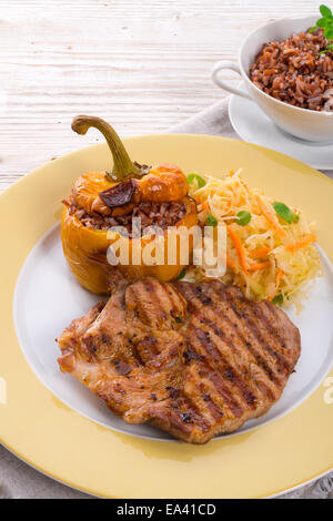 Steak with rice stuffed peppers Stock Photo