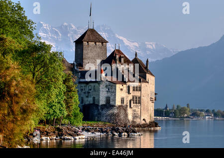 Chillon Castle and the Dents du Midi mountains on Lake Geneva, Switzerland Stock Photo