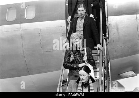 (File) Andy Warhol (middle), Jane Forth and Joe Dallesandro arrive for the premiere of Warhol's latest film 'Trash' in Munich on 17.02.1971. Stock Photo