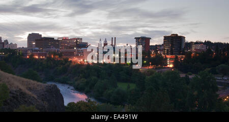 The buildings still have the lights on as the sun comes up in Spokane Washington Stock Photo