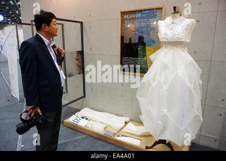 Ilsan, Gyeonggi Province of South Korea. 6th Nov, 2014. A wedding dress made of renewable material is seen on the exhibition of 2014 Design Korea in Ilsan, Gyeonggi Province of South Korea, Nov. 6, 2014. © Peng Qian/Xinhua/Alamy Live News Stock Photo