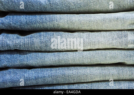 Blue denim jeans folded as a background image Stock Photo