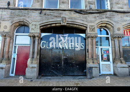 Stock Photo -Jamson Whiskey and Guinness signs on Irish pub exterior. Photo: George Sweeney/Alamy Stock Photo