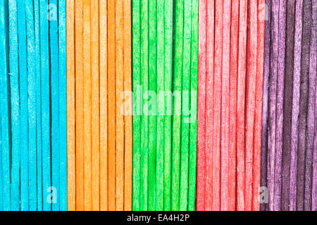 Colorful wooden sticks in a row as a background image Stock Photo