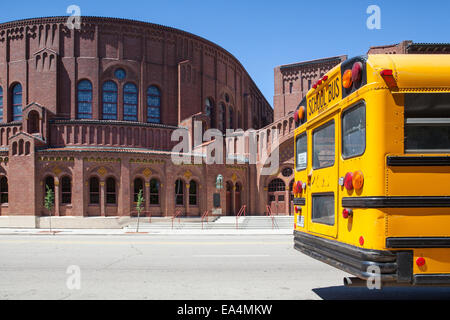 CHICAGO,USA - JULY 12,2013 : Typical american yellow school bus before the D.L.Moody memorial church and sunday school in Chicag Stock Photo