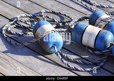 Nautical scene with blue buoys on a rope Stock Photo