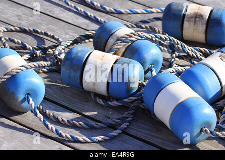 Nautical scene with blue buoys on a rope Stock Photo