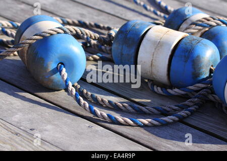 Nautical scene with blue buoys on a rope Stock Photo