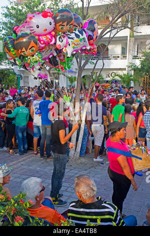 Balloon seller at a street parade in Santa Marta Stock Photo