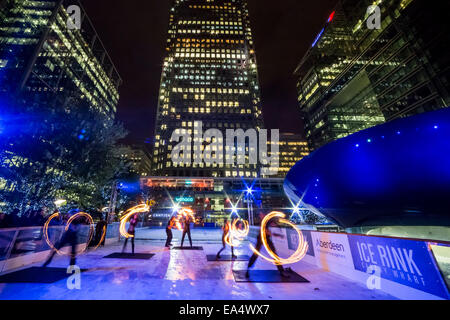 London, UK. 6th Nov, 2014.  Canary Wharf Ice Rink launches with ‘Human Fire Torch’ spectacle Credit:  Guy Corbishley/Alamy Live News Stock Photo