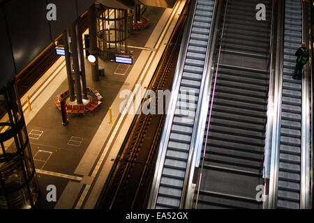 Berlin, Germany. 6th Nov, 2014. A passenger rides an escalator inside the central train station in Berlin, Germany, on Nov. 6, 2014. German train drivers staged a record-long strike against state-owned railway company Deutsche Bahn (DB) on Wednesday, ignoring criticism and appeals from passengers, business and government. The strike began with DB's freight train drivers laying down their jobs as planned on Wednesday afternoon and involved passenger train drivers from early Thursday. © Zhang Fan/Xinhua/Alamy Live News Stock Photo