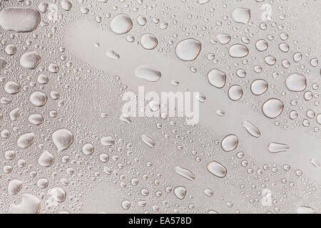 Metal surface covered in water drops bottom, closeup. Stock Photo