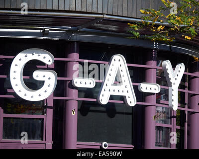 Gay bar sign on Canal Street in Manchester UK Stock Photo