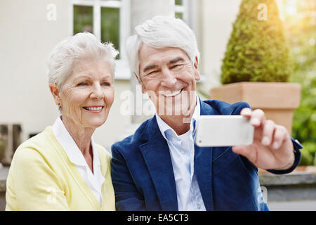 Germany, Hesse, Frankfurt, Senior couple photographing selves Stock Photo