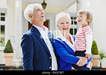 Germany, Hesse, Frankfurt, Senior couple with granddaughter on arm Stock Photo