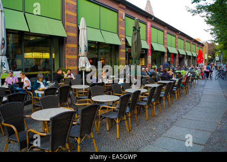 Restaurant and bar terraces outside market hall, Kreuzberg, west Berlin, Germany Stock Photo