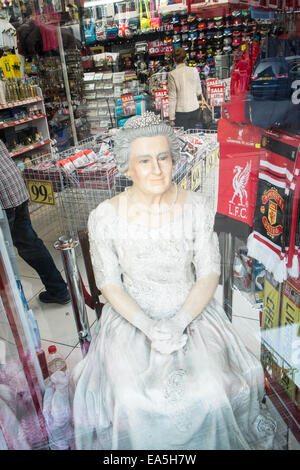 The fake Queen,Elizabeth II, sits in souvenir shop Live London:Shop Plaza,Oxford Street,London,England,U.K., Stock Photo