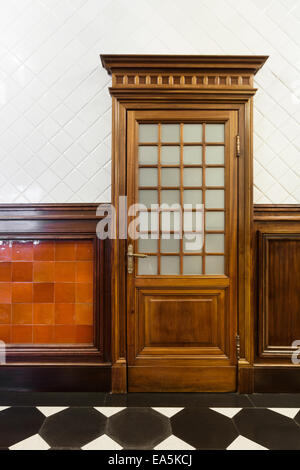 interior of a beautiful old building, detail of hardwood door Stock Photo
