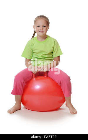 Little girl on a gymnastic ball Stock Photo