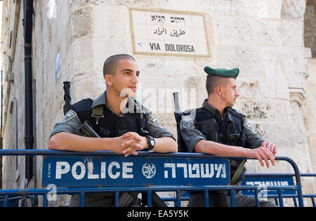 Two police officers are taking care of the security in the old city of Jerusalem on the via Dolorosa in the old city Stock Photo