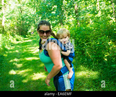 Mother and son hiking in the woods, Indiana, USA Stock Photo