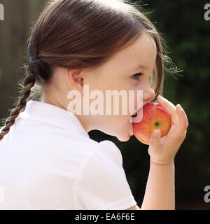 Portrait of a girl eating apple Stock Photo