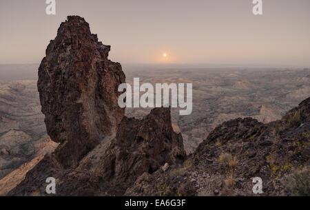 USA, Arizona, Kofa National Wildlife Refuge, Full Moon Rising from Castle Dome Stock Photo