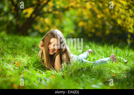 girl on grass in park Stock Photo