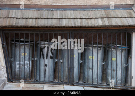 Belonging to apartments this bins under lock and key. Stock Photo