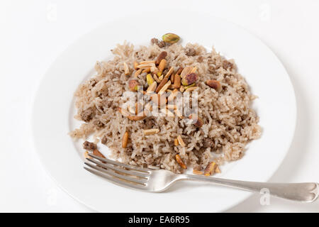Lebanese spiced rice with minced beef and garnished with freshly toasted nuts Stock Photo