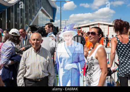 Man and woman pose with a cardboard cutout of Queen Elizabeth II at the official opening of Reading Railway Station. Stock Photo