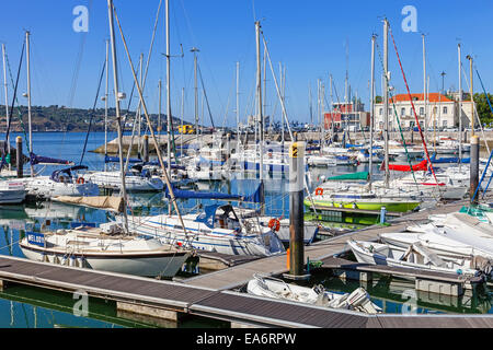 Doca do Bom Sucesso Marina in Belem district filled with docked yachts, sailboats and motorboats during summer. Lisbon, Portugal Stock Photo