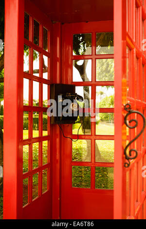 old classic dial phone  in red booth Stock Photo