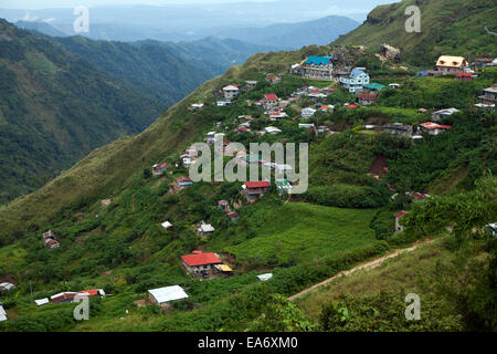 Homes and farms are perched on the steep slopes of mountainsides in Baguio, Philippines. Stock Photo