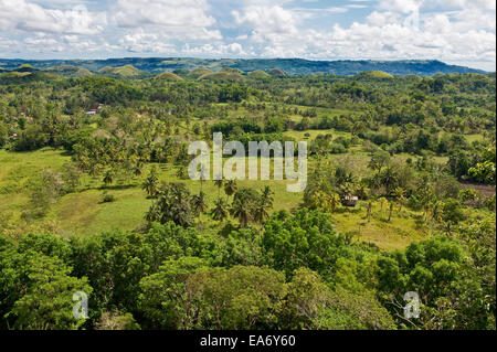 Landscape overlooking surrounding land and Chocolate Hills on Bohol Island in the Philippines, a popular tourist destination. Stock Photo