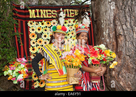 Two beautiful Filipina women dress in traditional Ifugao clothing at Mines View Park in Baguio City, Philippines. Stock Photo