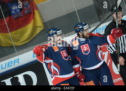 Munich, Germany. 07th Nov, 2014. Slovakia's Rastislav Dej (l) and Roman Rac celebrate the 2-0 goal during the Deutschland Cup match between Canada and Slovakia in the Olympic Eissporthalle in Munich, Germany, 07 November 2014. Photo: ANDREAS GEBERT/dpa/Alamy Live News Stock Photo