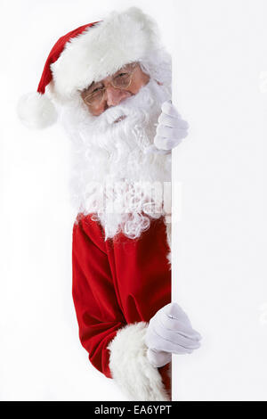 Santa Claus holding white frame in his hands Stock Photo - Alamy