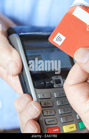 Customer Making Purchase Using Contactless Payment Stock Photo