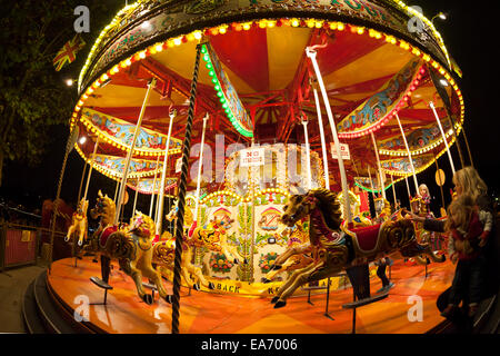 Merry-go-round on the riverside promenade after dark, South Bank, London Stock Photo